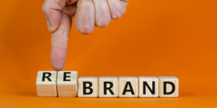 Wooden cubes spelling word rebrand